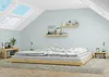 A bedroom with a low wooden bed, skylights, and a bedside table. Produktbild-Vorschau