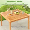 A wooden table set up outdoors with drinks and snacks. Anteprima dell’immagine prodotto