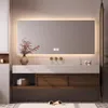 A modern bathroom vanity with a large LED mirror, sink, and storage cabinets. Anteprima dell’immagine prodotto