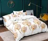 A bedroom scene with a bed dressed in dandelion-themed bedding, a floor lamp, and a chair with a pillow. Produktbild-Vorschau