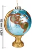 A glass globe ornament with a gold stand and chain, showing continents with glitter accents. Voir les images du produit