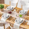 A table setting with dinnerware, cutlery, and decorative items. Náhled obrázku produktu