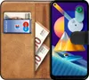 A book-style phone case with a Samsung Galaxy M11 phone inside, along with a credit card and euro banknotes. Náhled obrázku produktu