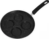 A black frying pan with four circular indentations for cooking eggs or pancakes, set against a white background. Voir les images du produit