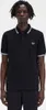 A man wearing a black Fred Perry polo shirt. Produktbild-Vorschau