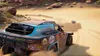 A rally car driving through a desert, kicking up dust. Produktbild-Vorschau