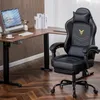A gaming chair and a desk with a computer are shown in a room. Produktbild-Vorschau