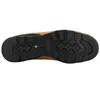 The sole of a tan and black Timberland boot is shown against a white background. Voir les images du produit