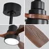 A collage of four close-up images showcasing details of a modern ceiling fan with wooden blades and a black motor housing. One image shows the mounting hardware, another the connection between the motor and blades, a third the integrated LED light, and the Produktbild-Vorschau