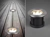 A split image showing ground lights installed on a wooden deck and a close-up of one of the lights. Podgląd zdjęcia produktu