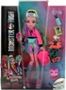 A Monster High doll named Lagoona Blue is displayed in her packaging, along with various accessories. Produktbild-Vorschau