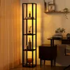 A floor lamp with shelves is placed next to a desk in a room with warm lighting. Anteprima dell’immagine prodotto