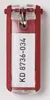 A red key tag with a white label showing text. Produktbild-Vorschau