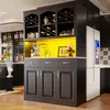 A modern kitchen cabinet with a refrigerator and various kitchen appliances. Anteprima dell’immagine prodotto
