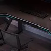 A gaming desk with a keyboard and chair, featuring integrated lighting. Podgląd zdjęcia produktu