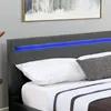 Close-up of a bed with pillows and a headboard featuring blue LED lighting. Náhled obrázku produktu