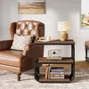 A living room scene with a chair and a side table. Produktbild-Vorschau
