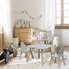 A child's bedroom or playroom with a crib, dresser, and a small table and chairs set. Náhľad obrázku produktu