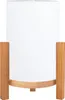 A white cylinder-shaped lamp with a wooden base and legs, shown against a white background. Produktbild-Vorschau