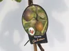 A tag on a plant stem showing images of figs and text indicating the plant's name and variety. Náhled obrázku produktu