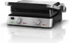A studio shot of a Braun electric grill on a reflective white surface. Podgląd zdjęcia produktu