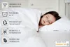 A young girl sleeping peacefully under a white duvet. Náhled obrázku produktu
