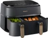 A close-up shot of a black Philips air fryer with dual baskets, one containing broccoli and the other containing pieces of bread. The air fryer has a digital display on top and gold accents on the handles. Anteprima dell’immagine prodotto