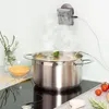 A pot of soup boiling on a stove with a thermometer attached to the pot. Produktbild-Vorschau