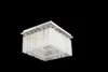 A square-shaped chandelier with multiple tiers of glass rods hanging from a chrome-plated metal frame, set against a black background. Produktbild-Vorschau