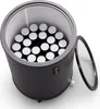 A top-down view of a black mini-fridge filled with cans, with the glass lid open. Produktbild-Vorschau