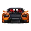 Front view of an orange and black Lego-like car model. Anteprima dell’immagine prodotto