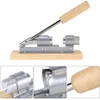 A mechanical nutcracker with a wooden base and handle, shown against a white background. Voir les images du produit
