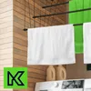A laundry room scene with towels hanging on a drying rack above a washing machine. Produktbild-Vorschau
