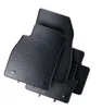 A set of black rubber car floor mats stacked on a white background. Produktbild-Vorschau