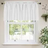 A white valance curtain is hung above a white-framed window, with greenery visible outside. Produktbild-Vorschau