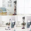 Collage of living room scenes featuring a vacuum cleaner and its accessories. Voir les images du produit