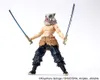 A figurine of Inosuke Hashibira from Demon Slayer, posed with two swords. Náhled obrázku produktu