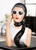 A decorative bust of a woman wearing a headscarf, sunglasses, and a scarf. Anteprima dell’immagine prodotto