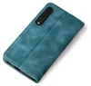 A teal flip cover phone case is shown against a white background. Produktbild-Vorschau