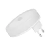 A white LED night light with a motion sensor, plugged into a wall socket. Podgląd zdjęcia produktu