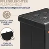 A close-up of a black storage ottoman with water droplets on the lid, accompanied by marketing text and icons. Produktbild-Vorschau