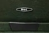 A close-up view of a green fabric suitcase with a black leather accent and a silver RGL logo. Podgląd zdjęcia produktu