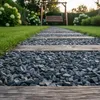 Grauer Splitt als Gartenpfad mit Holzschwellen im Rasen Produktbild-Vorschau