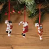 Three Christmas ornaments hanging from a pine branch. Podgląd zdjęcia produktu