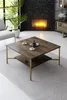 A living room scene with a fireplace, sofa, and coffee table. Produktbild-Vorschau