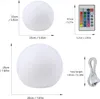 Diagram showing dimensions of two LED ball lights and a remote control. Podgląd zdjęcia produktu