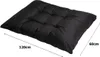 A black cushion is shown from a diagonal angle with dimensions indicated. Voir les images du produit