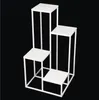 A white, multi-tiered display stand against a black background. Anteprima dell’immagine prodotto