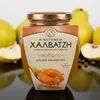 Halvatzis Quittenstücke in Sirup 500 g mit frischen Quitten im Licht Produktbild-Vorschau