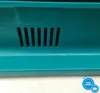A close-up view of a teal-colored plastic surface with a vent. Produktbild-Vorschau
